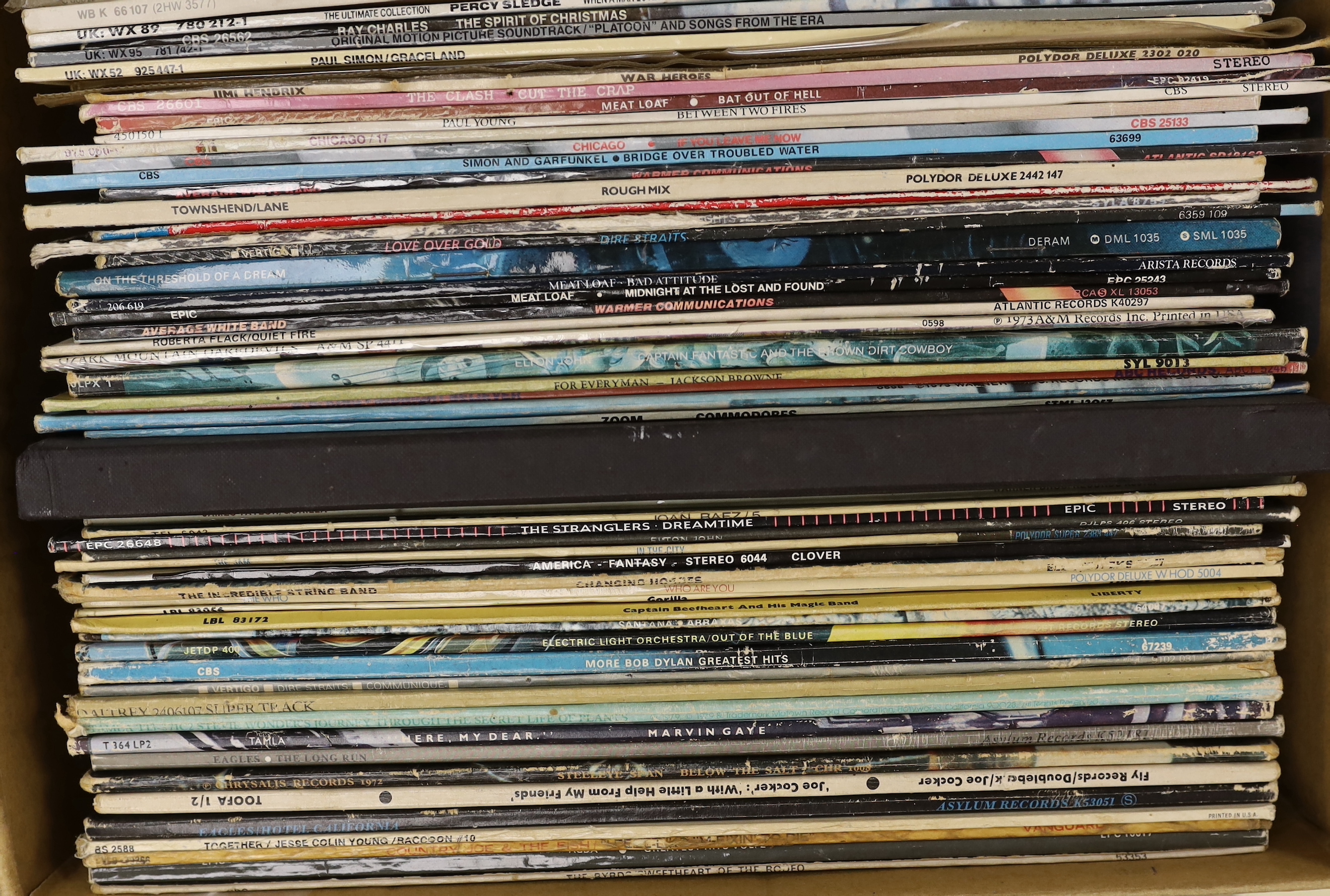 Sixty-nine LP record albums, by artists including; The Beach Boys, George Benson, Paul Simon, The Clash, Meat Loaf, Average White Band, Dire Straits, Elton John, ELO, Eagles, Joe Cocker, etc.